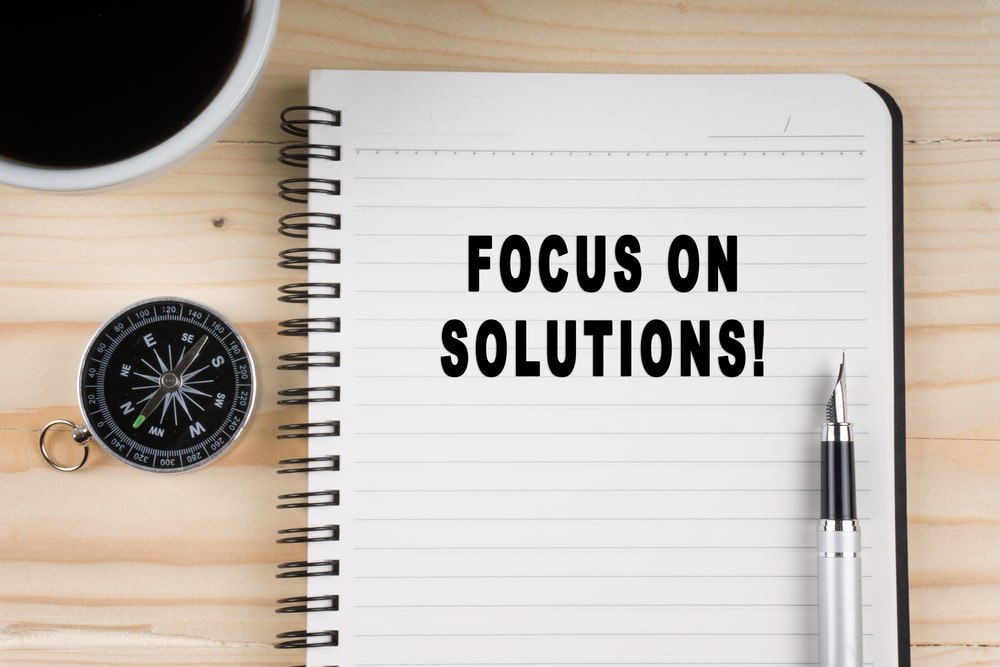 Notebook With Title Focus On Solutions