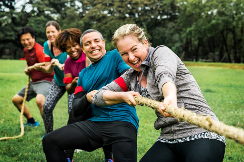 Multiple People Pulling On A Rope