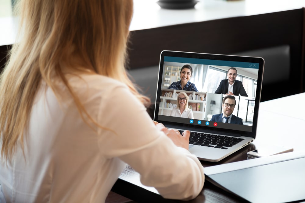 Woman On Her Laptop Attending An Online Meeting