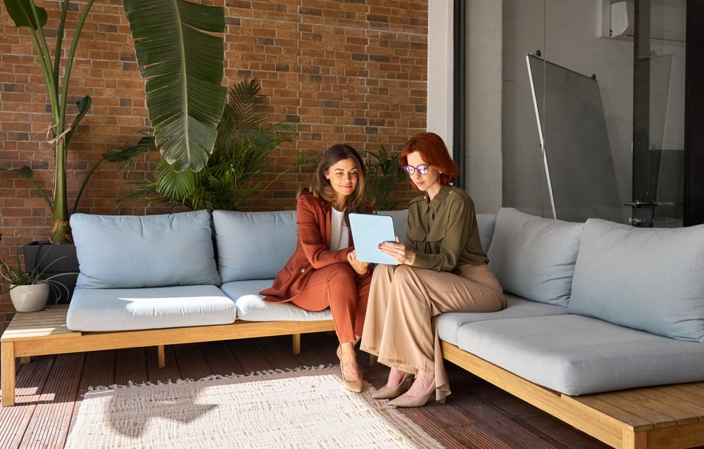 Two female employees having a conversation