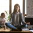 Businesswoman meditating at workplace, avoiding problems at work