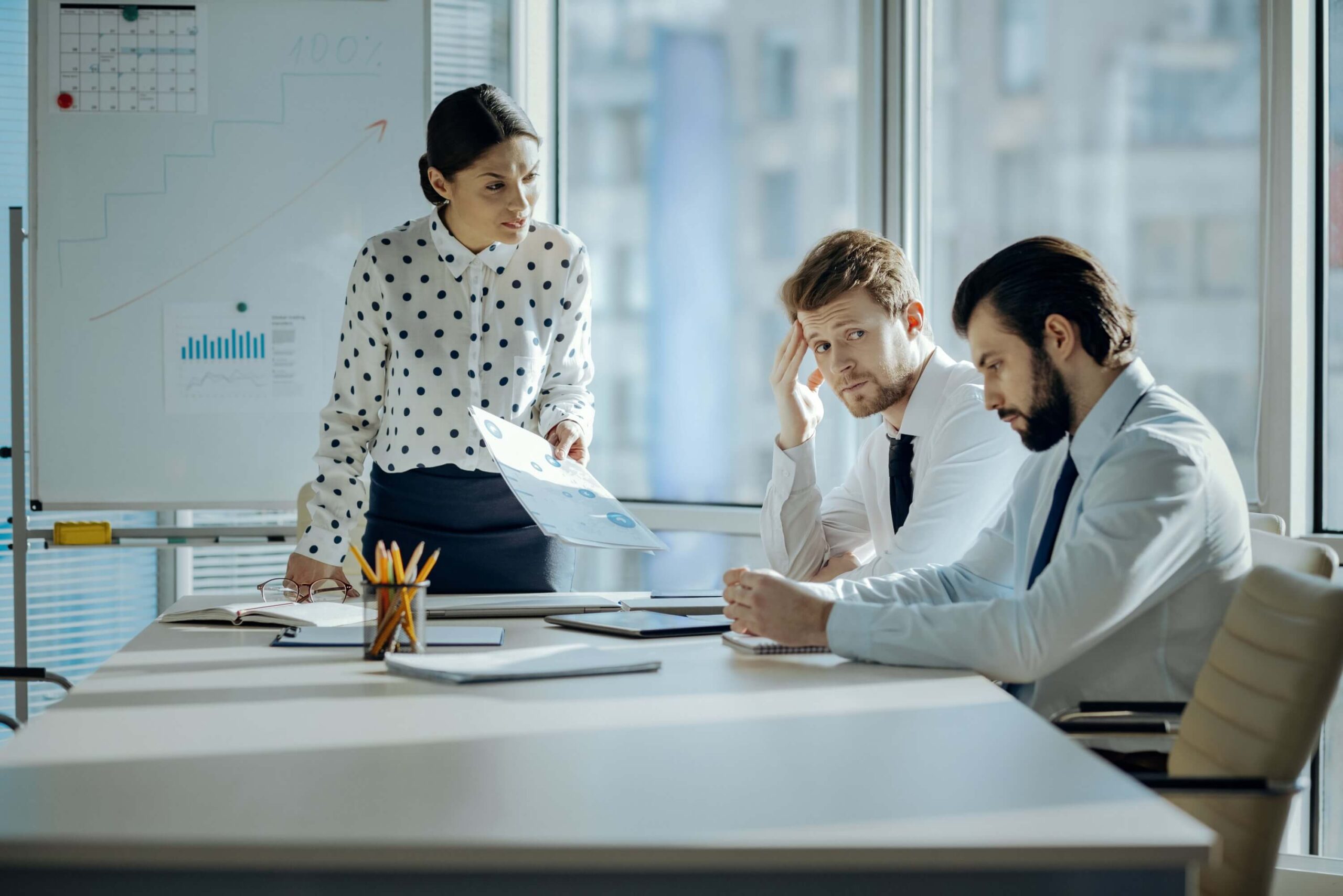 Bad work. Angry female boss holding a meeting with her employees